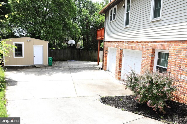2616 Osage St, Hyattsville, MD 20783 - garage with driveway and fence