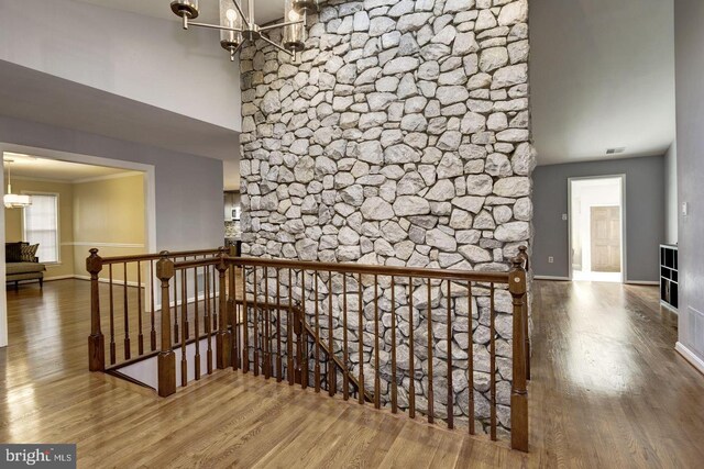 2616 Osage St, Hyattsville, MD 20783 - hallway featuring an upstairs landing, a chandelier, wood finished floors, and baseboards
