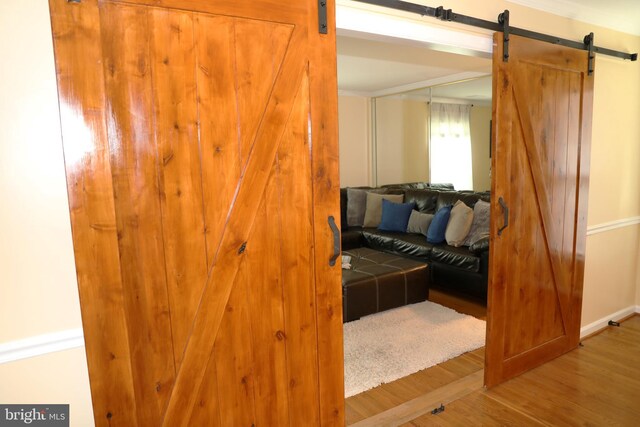 2616 Osage St, Hyattsville, MD 20783 - interior space featuring a barn door and wood finished floors