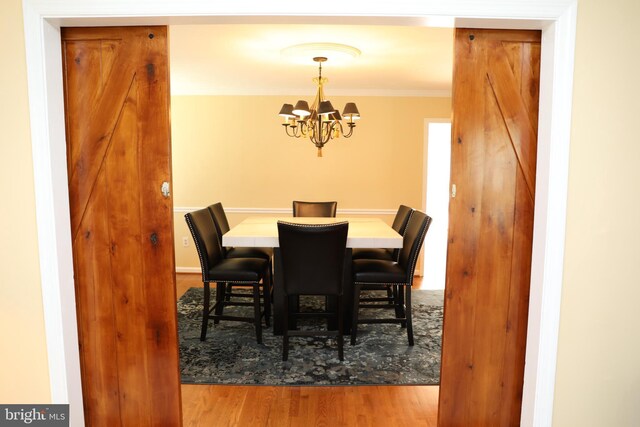 2616 Osage St, Hyattsville, MD 20783 - dining area featuring a chandelier, crown molding, and wood finished floors