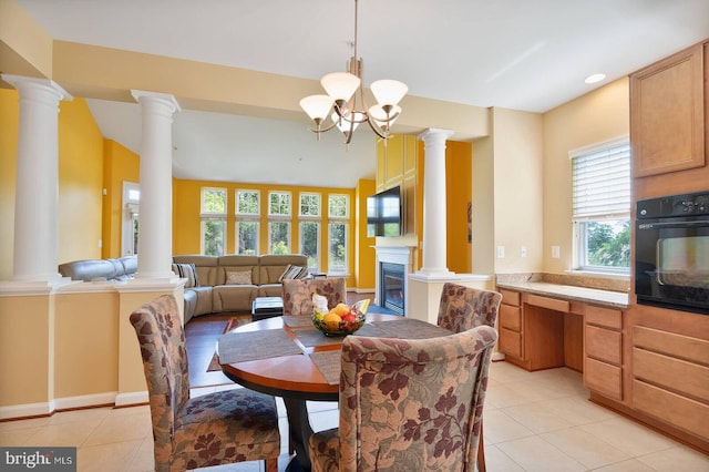 7419 Near Thicket Way, Laurel, MD 20707 - dining room with light tile patterned floors, ornate columns, and a chandelier