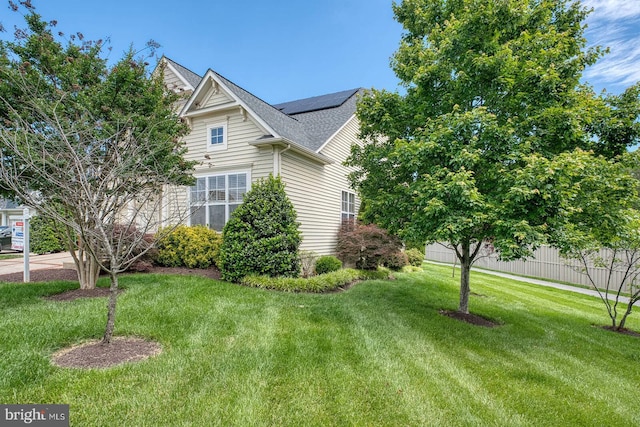 7419 Near Thicket Way, Laurel, MD 20707 - view of side of property featuring roof mounted solar panels, a yard, and a shingled roof