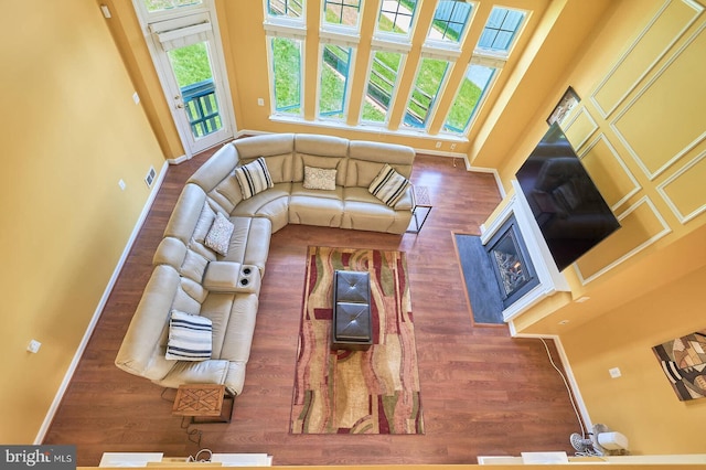 7419 Near Thicket Way, Laurel, MD 20707 - living area with wood finished floors, baseboards, and a glass covered fireplace