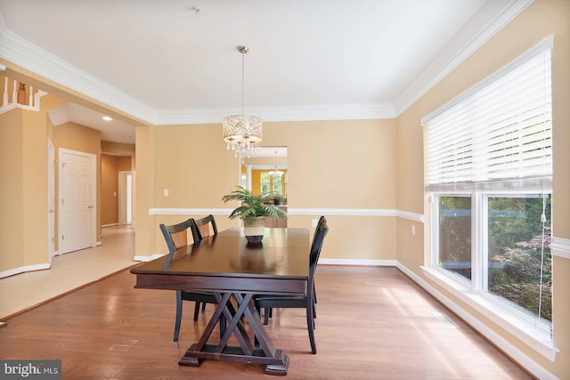 7419 Near Thicket Way, Laurel, MD 20707 - dining room with a chandelier, healthy amount of natural light, wood finished floors, crown molding, and baseboards