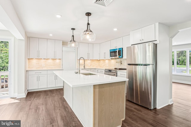 302 Fenwick Rd, Pilesgrove, NJ 08098 - kitchen featuring stainless steel appliances, a sink, dark wood-style floors, tasteful backsplash, and recessed lighting