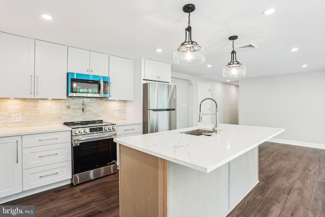 302 Fenwick Rd, Pilesgrove, NJ 08098 - kitchen with stainless steel appliances, a sink, recessed lighting, dark wood-style flooring, and backsplash