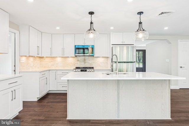 302 Fenwick Rd, Pilesgrove, NJ 08098 - kitchen with stainless steel appliances, light countertops, a sink, recessed lighting, and tasteful backsplash