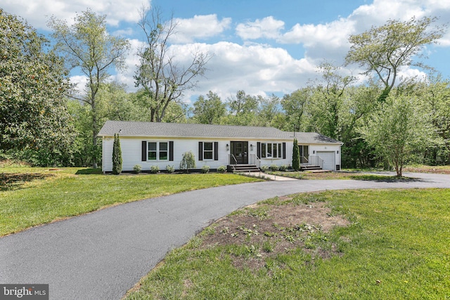 302 Fenwick Rd, Pilesgrove, NJ 08098 - ranch-style home featuring asphalt driveway, an attached garage, and a front lawn