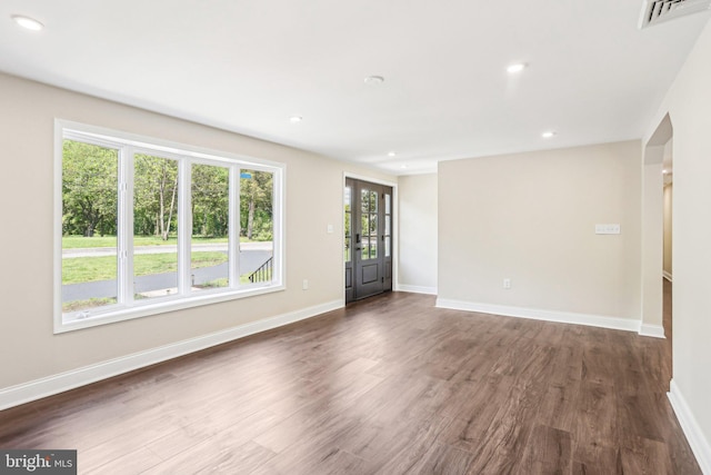 302 Fenwick Rd, Pilesgrove, NJ 08098 - unfurnished living room with dark wood-style floors, baseboards, and recessed lighting