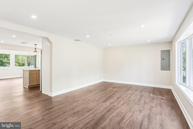 302 Fenwick Rd, Pilesgrove, NJ 08098 - empty room with electric panel, wood finished floors, healthy amount of natural light, and recessed lighting