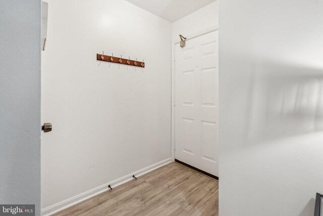 entryway with light wood-style floors