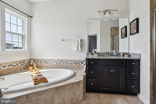 8219 Greenbelt Station Parkway Unit 310K, Greenbelt, MD 20770 - bathroom featuring a shower stall, a bath, and vanity