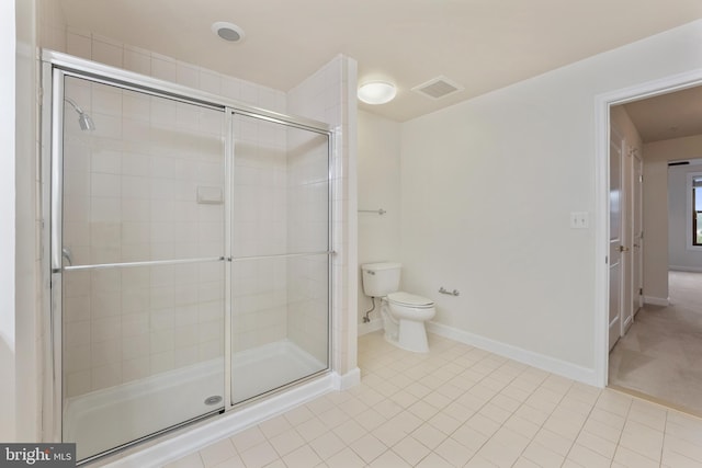 485 Harbor Side St Unit 405, Woodbridge, VA 22191 - bathroom featuring toilet, a shower stall, baseboards, and tile patterned floors