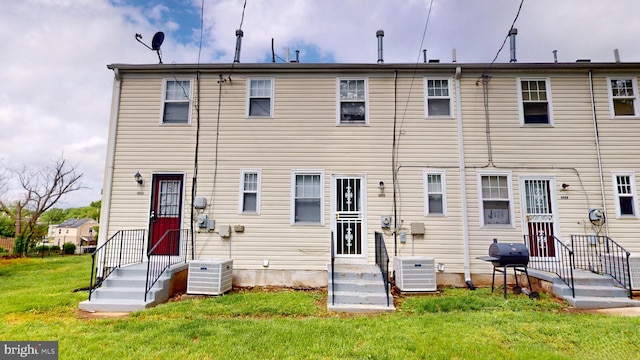 6940 Hawthorne St, Landover, MD 20785 - rear view of house with cooling unit and a lawn