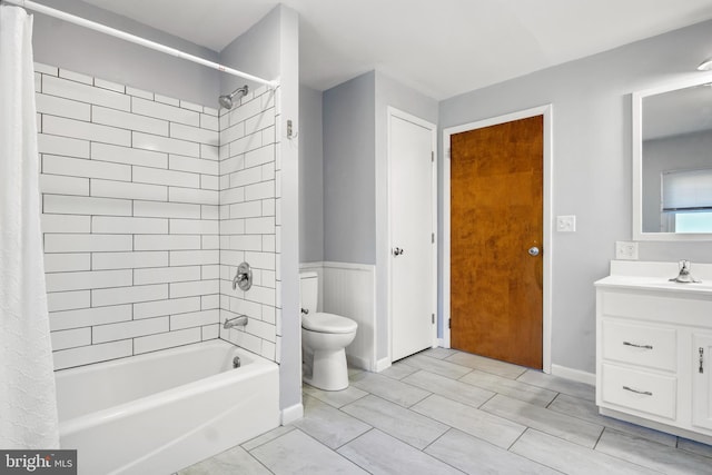 full bathroom with toilet, vanity, and shower / bathtub combination with curtain