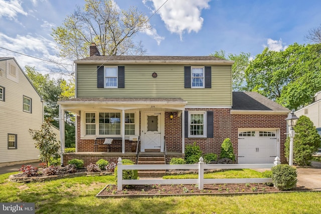 256 Crystal Ter, Haddonfield, NJ 08033 - traditional home with an attached garage, brick siding, a chimney, concrete driveway, and a front lawn