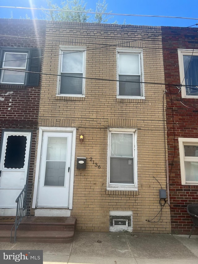 2136 E Tucker St, Philadelphia, PA 19125 - view of property with brick siding and entry steps