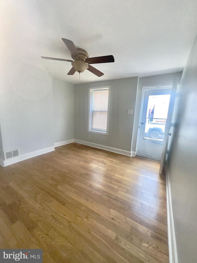 2136 E Tucker St, Philadelphia, PA 19125 - unfurnished room with wood finished floors, a ceiling fan, and baseboards