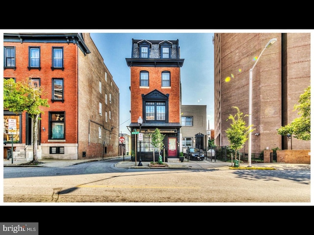 property entrance featuring brick siding