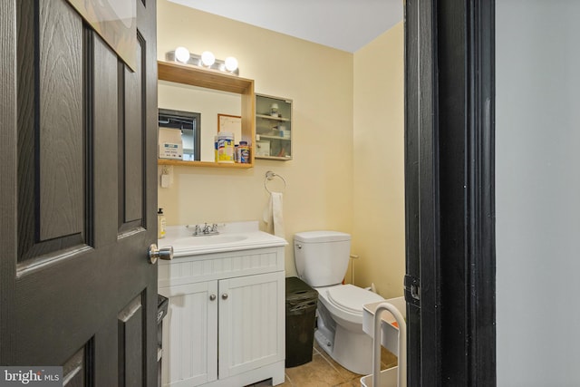 17 W Chase St, Baltimore, MD 21201 - bathroom with toilet, vanity, and tile patterned floors