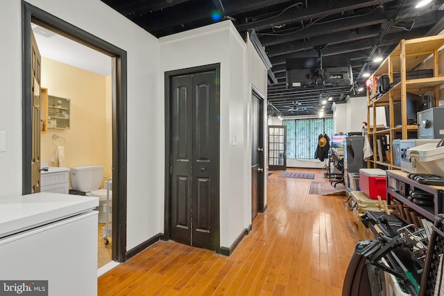 17 W Chase St, Baltimore, MD 21201 - hallway featuring light wood-style flooring and baseboards