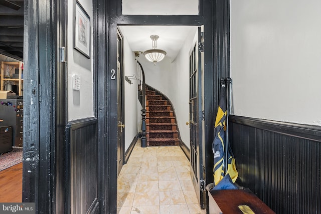 17 W Chase St, Baltimore, MD 21201 - foyer entrance with stairs, light marble finish floors, and wainscoting