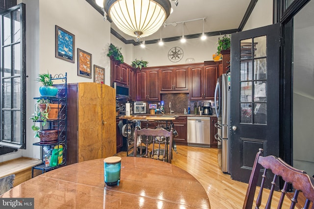 17 W Chase St, Baltimore, MD 21201 - dining area with light wood finished floors and track lighting