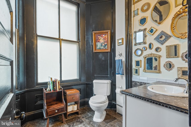 17 W Chase St, Baltimore, MD 21201 - bathroom with toilet, vanity, a wainscoted wall, and marble finish floors