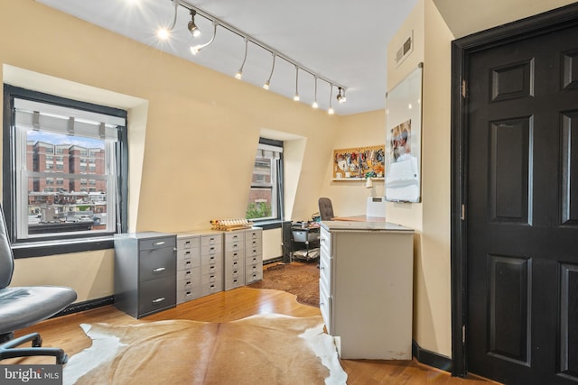 17 W Chase St, Baltimore, MD 21201 - office area with rail lighting and light wood-style flooring