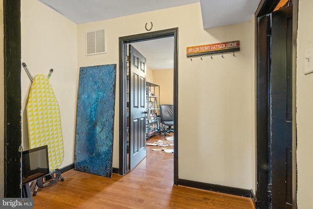 17 W Chase St, Baltimore, MD 21201 - hall featuring wood finished floors and baseboards