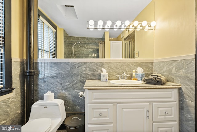 17 W Chase St, Baltimore, MD 21201 - full bathroom with tile walls, toilet, vanity, and a shower