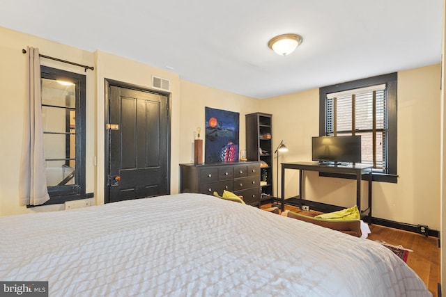 17 W Chase St, Baltimore, MD 21201 - bedroom with wood finished floors and baseboards