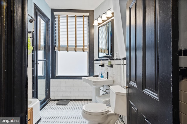 17 W Chase St, Baltimore, MD 21201 - full bathroom with toilet, tile walls, and a shower stall