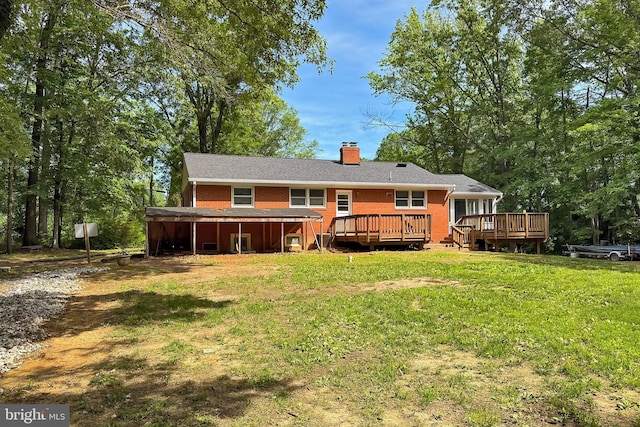 10621 Old Colchester Rd, Lorton, VA 22079 - rear view of house with brick siding, a chimney, a yard, and a wooden deck