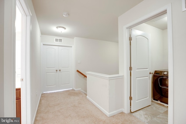 2527 Campus Way N Unit 69, Lanham, MD 20706 - hall with washer / dryer, an upstairs landing, baseboards, and light carpet