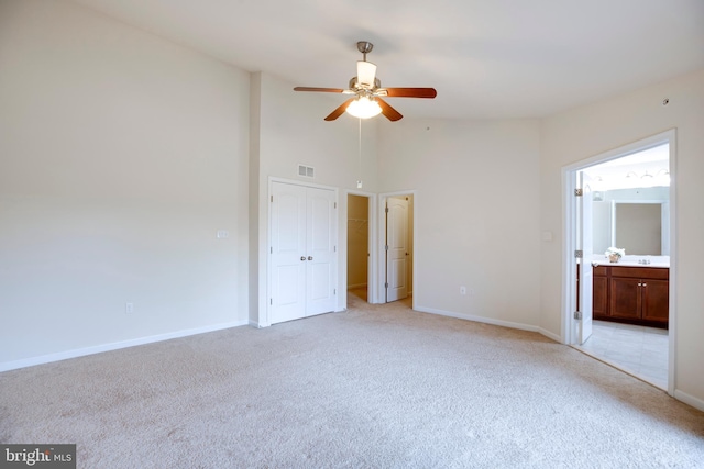 2527 Campus Way N Unit 69, Lanham, MD 20706 - unfurnished bedroom featuring light colored carpet, high vaulted ceiling, baseboards, connected bathroom, and ceiling fan