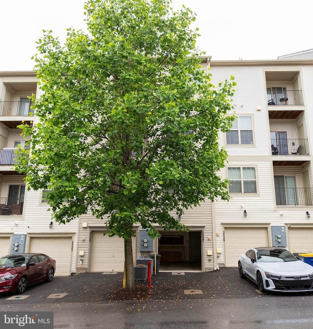 2527 Campus Way N Unit 69, Lanham, MD 20706 - view of property with driveway, cooling unit, and a garage