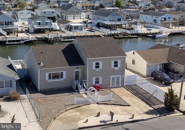 aerial perspective of suburban area featuring a large body of water