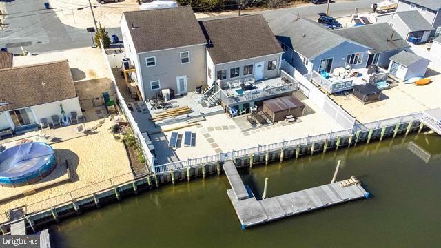 aerial perspective of suburban area featuring a large body of water