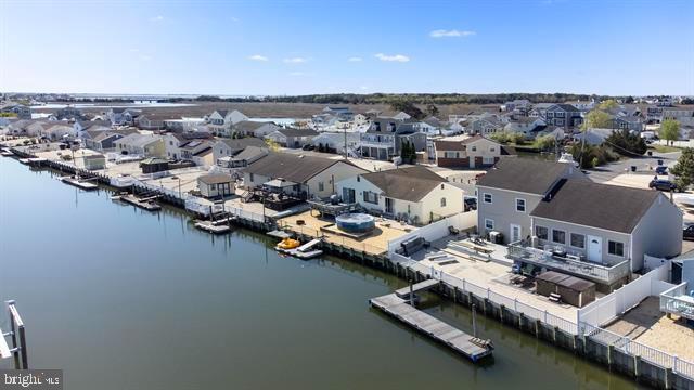 aerial view of residential area with a large body of water