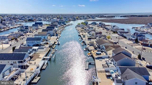 aerial view of residential area with a large body of water
