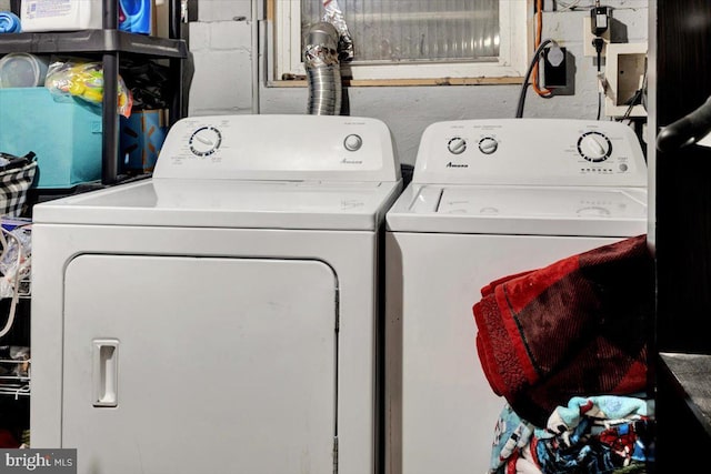 laundry room with separate washer and dryer