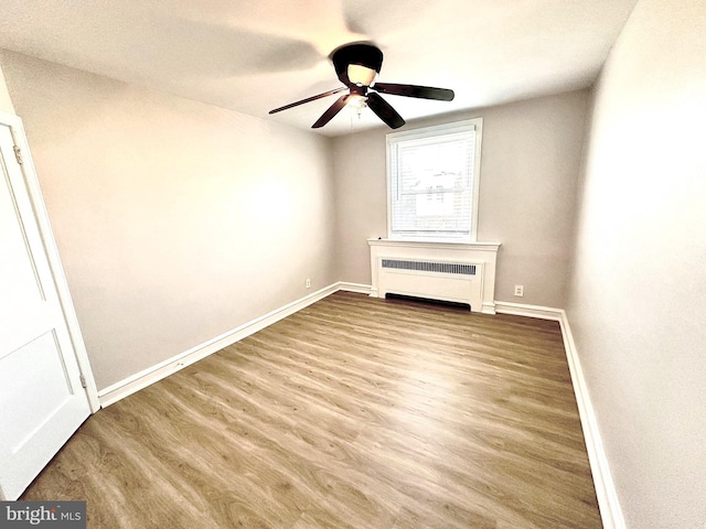 442 E Slocum St, Philadelphia, PA 19119 - spare room with radiator, baseboards, wood finished floors, and ceiling fan