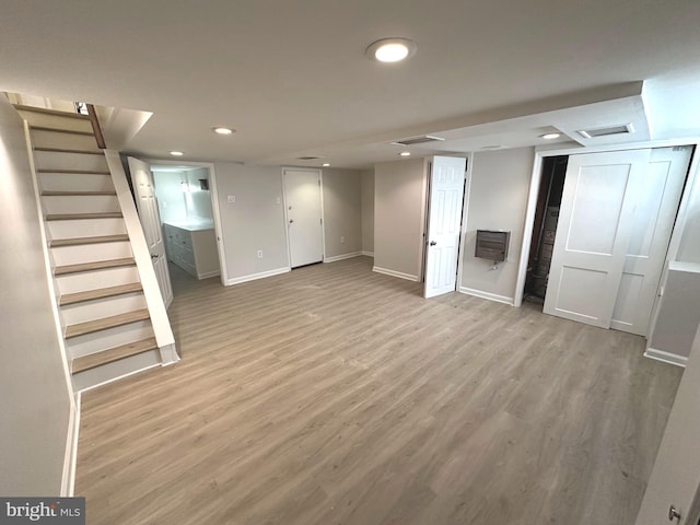 442 E Slocum St, Philadelphia, PA 19119 - finished below grade area with stairway, recessed lighting, light wood-style floors, and baseboards