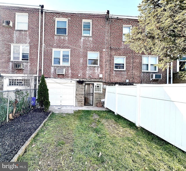 442 E Slocum St, Philadelphia, PA 19119 - back of property with a garage, fence, and brick siding