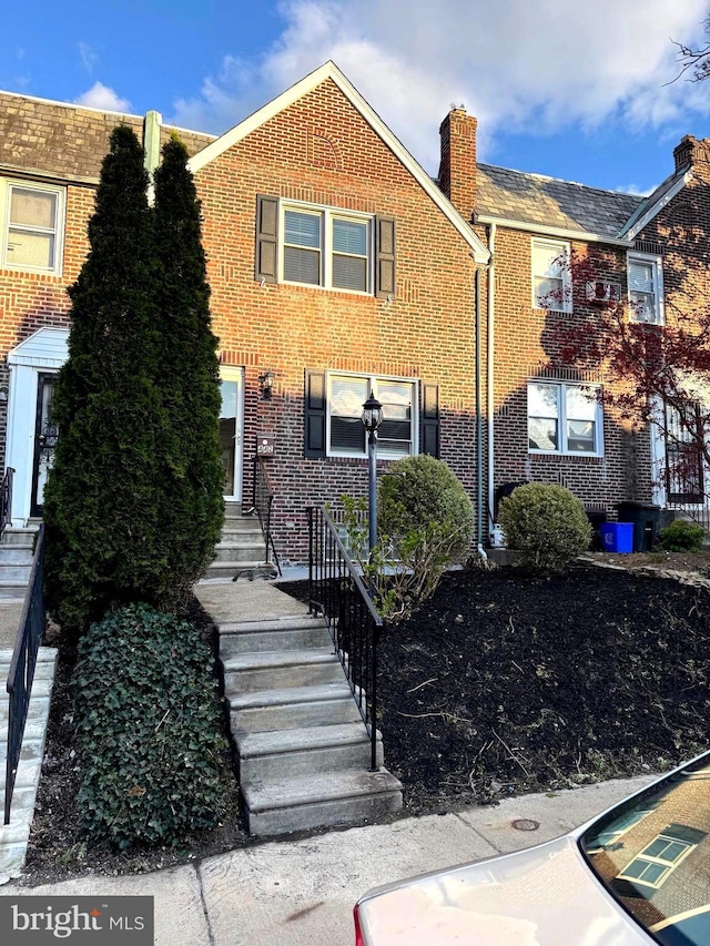 442 E Slocum St, Philadelphia, PA 19119 - townhome / multi-family property featuring brick siding and a chimney