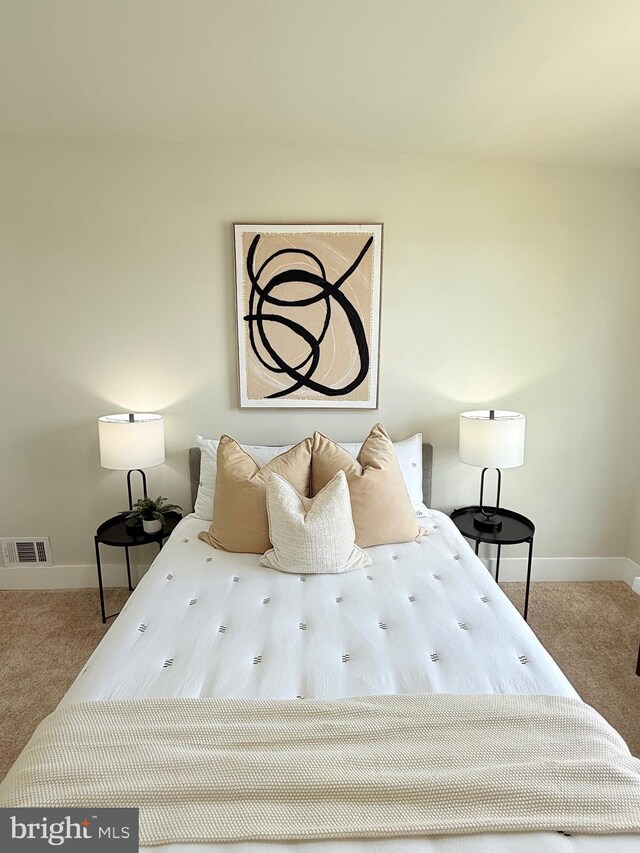 bedroom with carpet flooring and baseboards