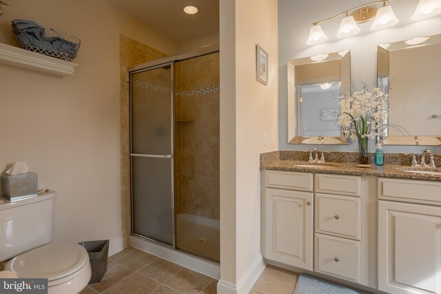 36725 Par Ln Unit 98, Frankford, DE 19945 - bathroom featuring a stall shower, toilet, tile patterned floors, baseboards, and double vanity