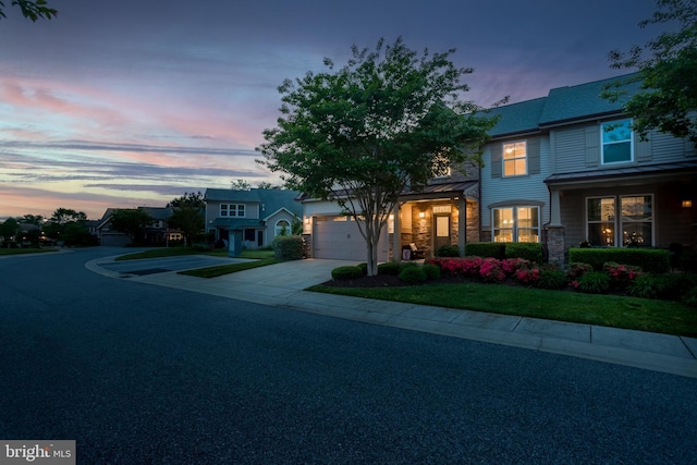 36725 Par Ln Unit 98, Frankford, DE 19945 - view of front of house with driveway, an attached garage, and stone siding