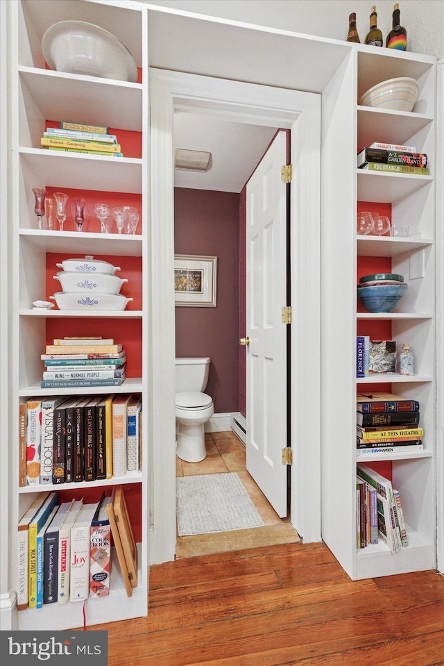 214 E Willow Grove Ave, Philadelphia, PA 19118 - bathroom featuring toilet, wood finished floors, and baseboard heating